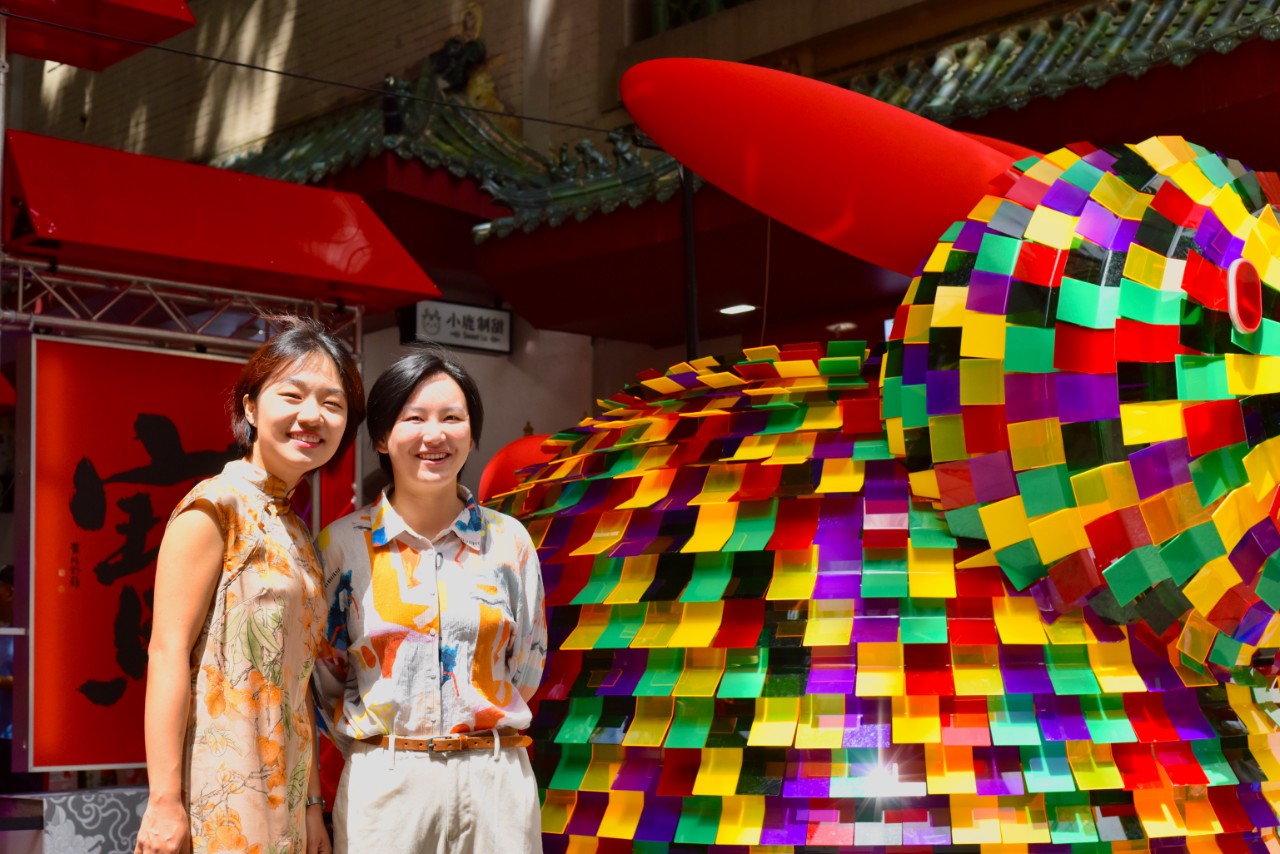 Meilun Gao & Yuxiao Wang of Studio Yu & Mei pictured with their giant rabbit lanterns A-hong and A-zi
