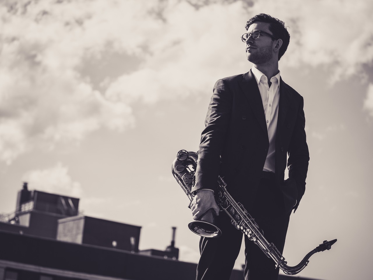 Male holding a saxophone