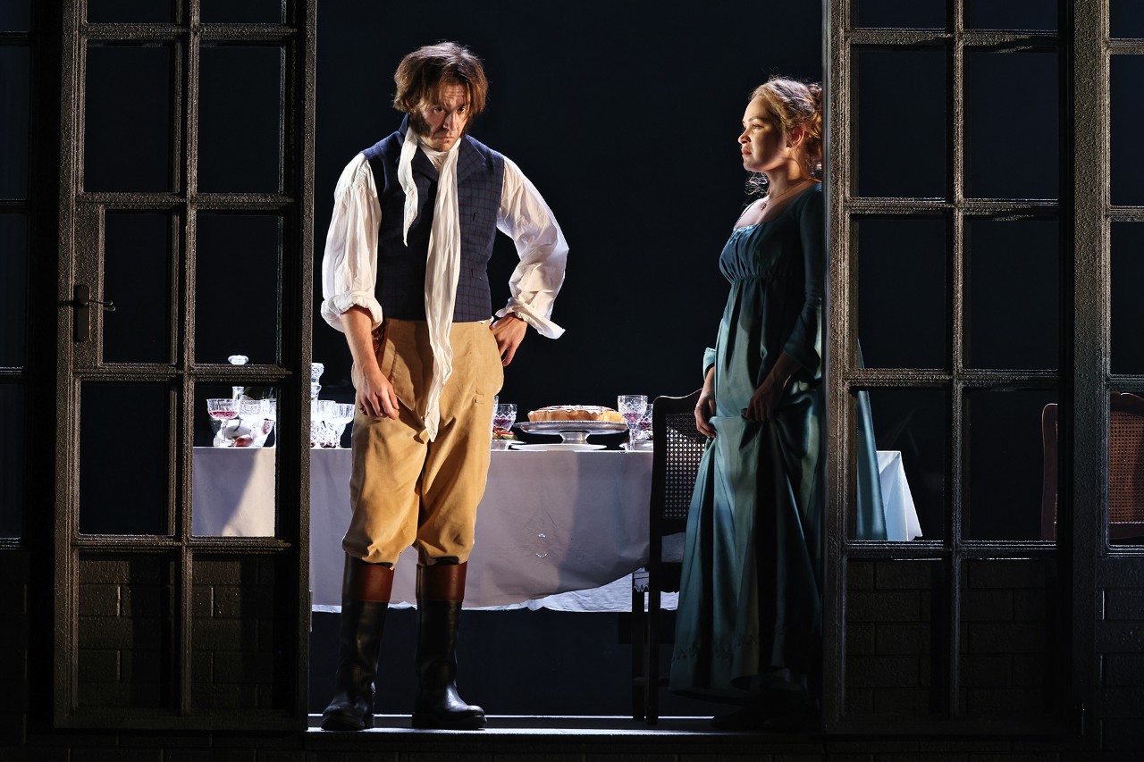 a young men looking messy like he hasn't slept with a young woman begging him to listen to her