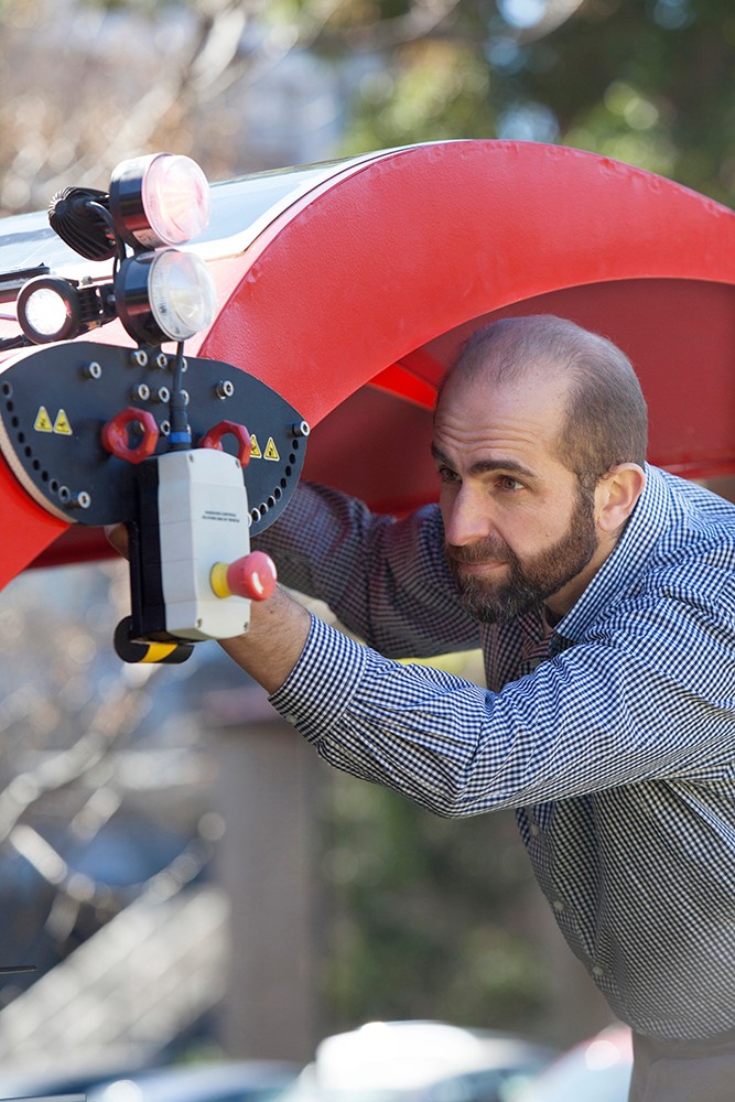 Professor Salah Sukkarieh tweaking his Ladybird agricultural robot