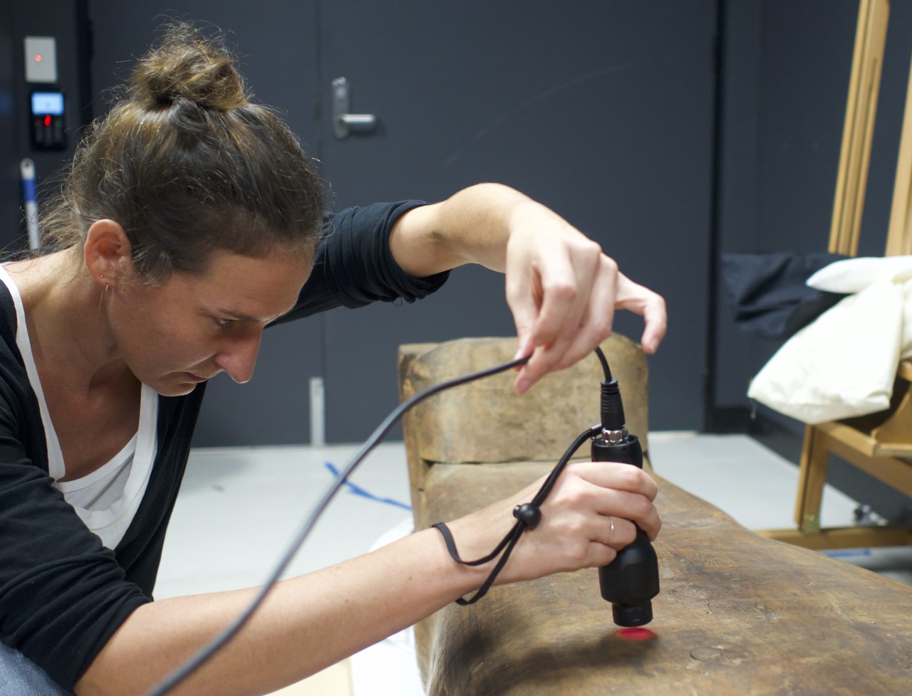 portable instrument held by woman
