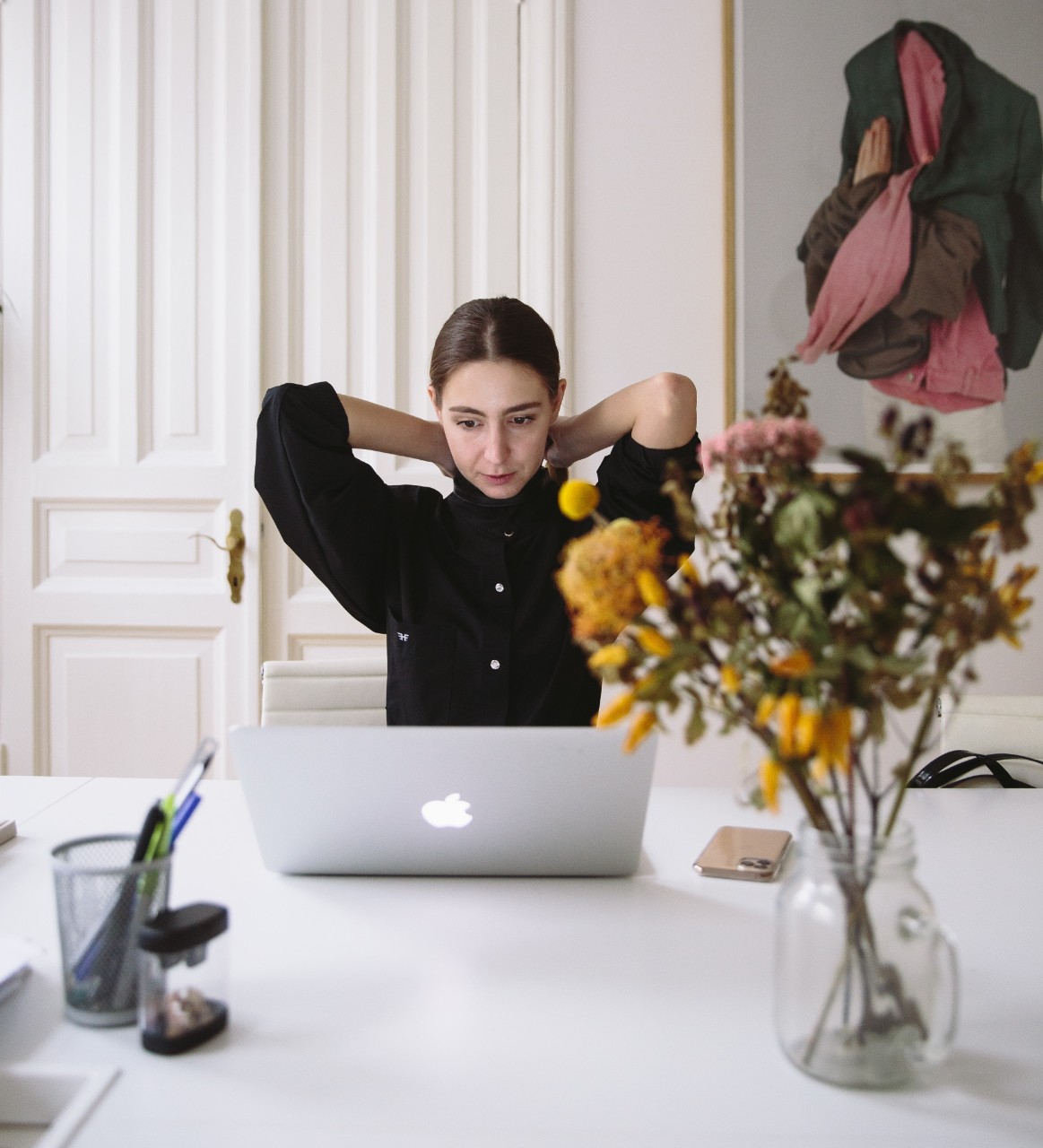 Woman working from laptop in kitchen