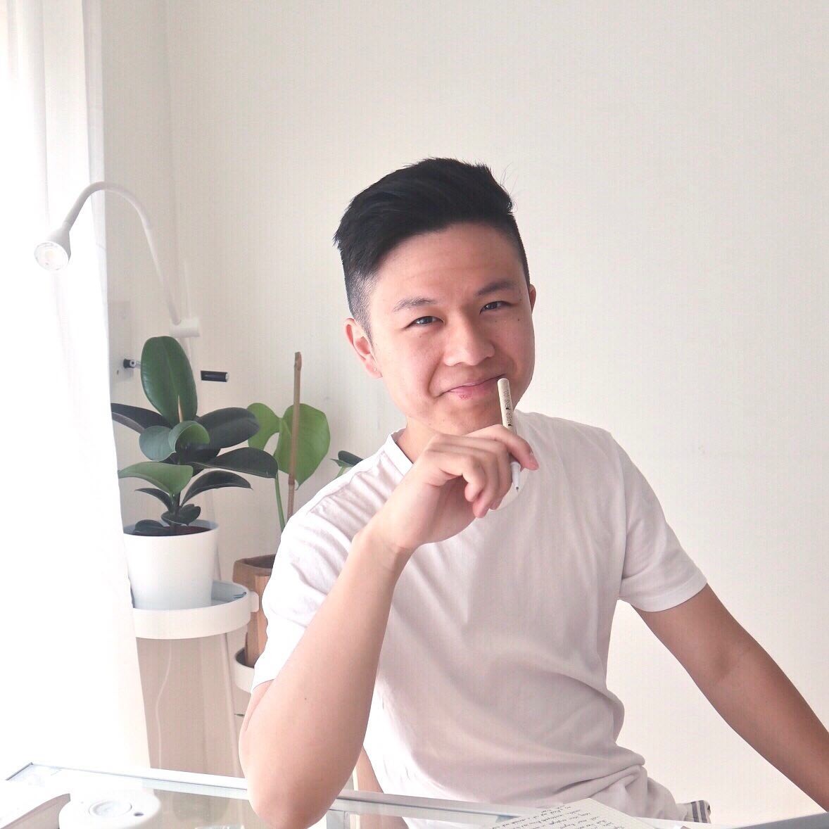 William Tjo holding an eco-friendly pen