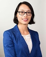 Asian woman wearing suit