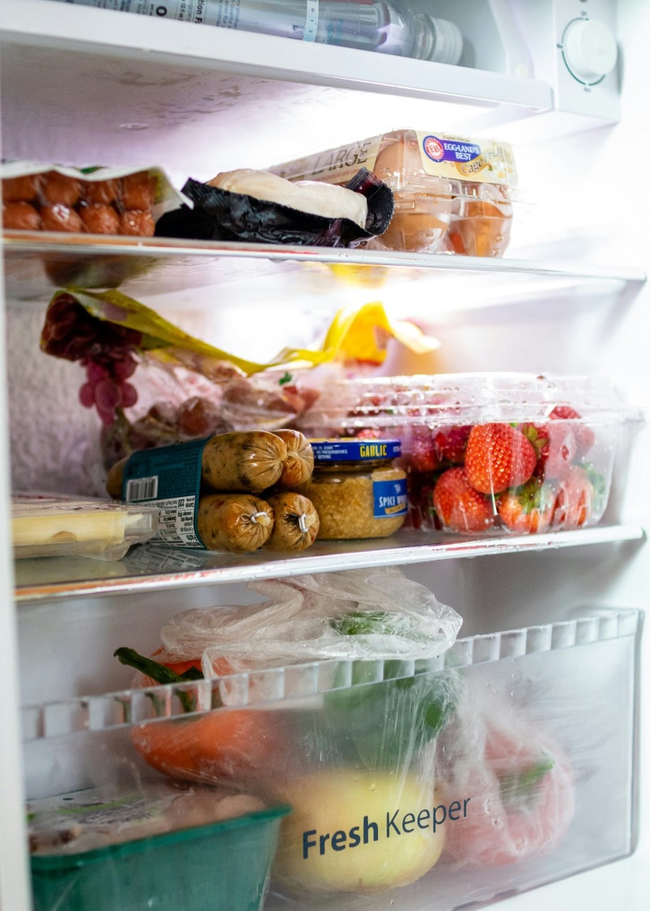 An open fridge with food inside