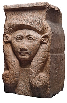A sculpture of Hathor on red granite column