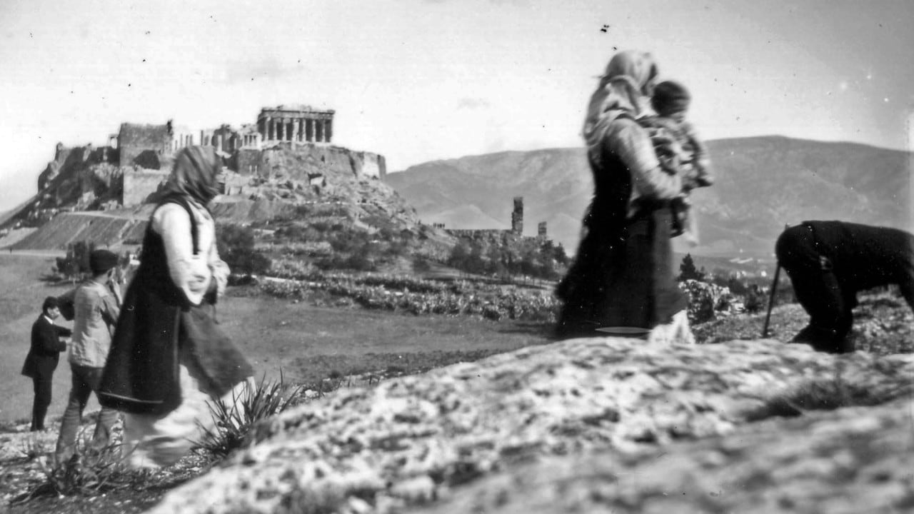 Black and white photograph of Greek countryside by William J Woodhouse, with the Acropolis in the distance.