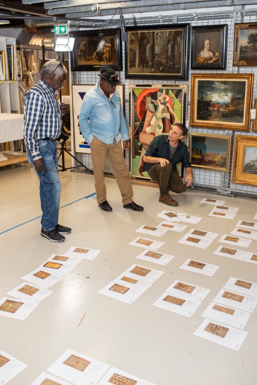 Yolngu leaders look at artworks from the collection