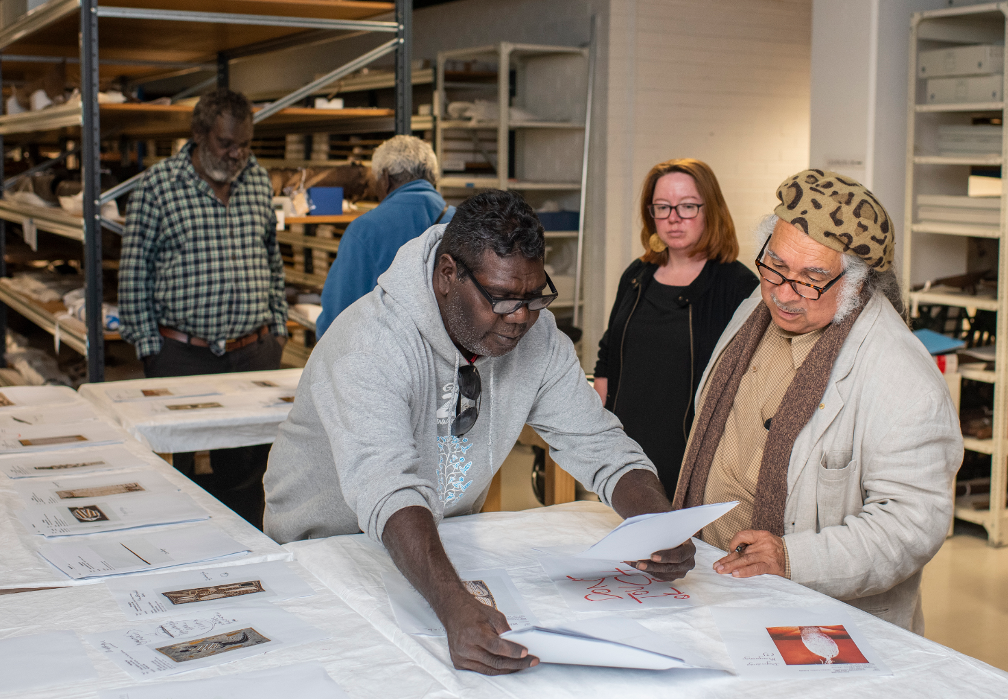 Yolngu elders look at artworks in the collection