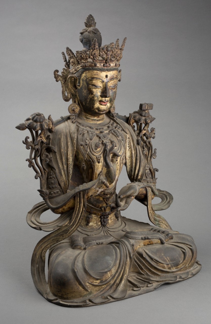 Cast bronze seated figure of Chinese deity, Wenshu.