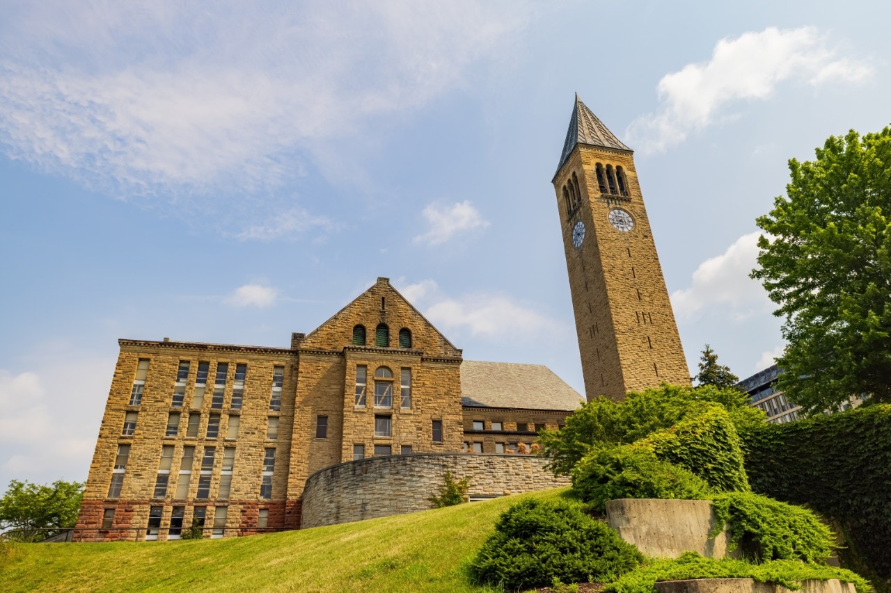 Sunny exterior view of Uris Library and McGraw Tower of Cornell University