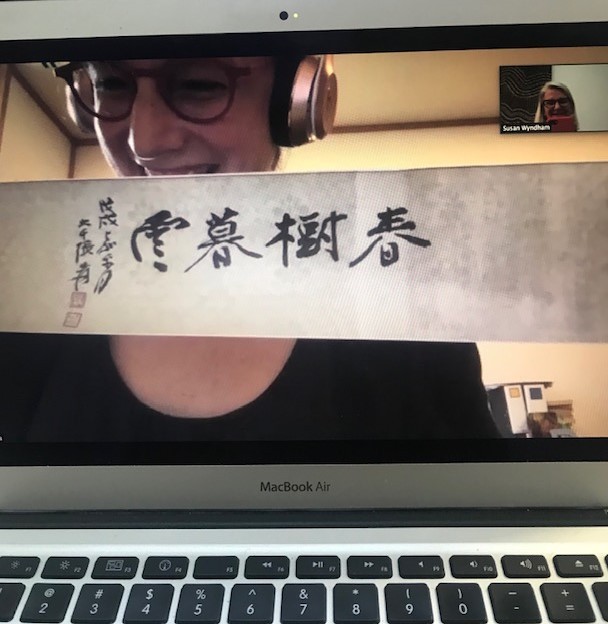 Heidi Stalla presenting a copy of a painted Friendship Scroll