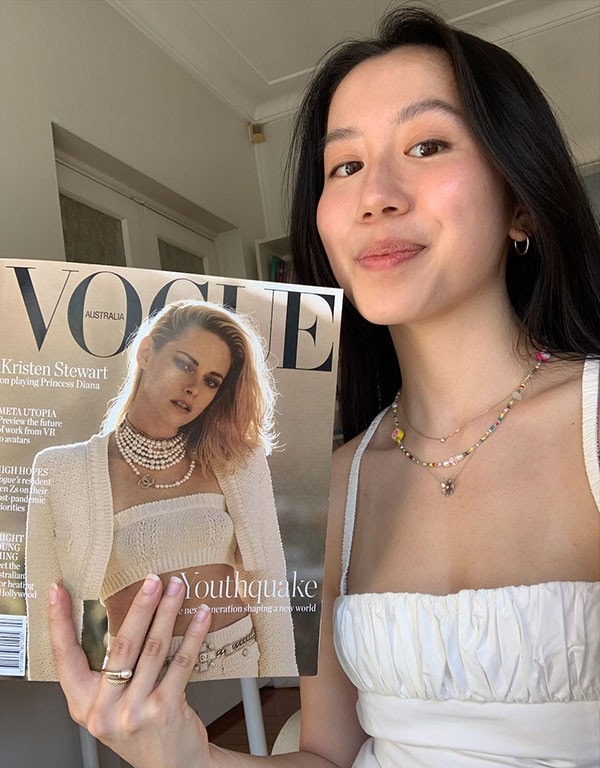 Gladys Lai holding an issue of Vogue magazine