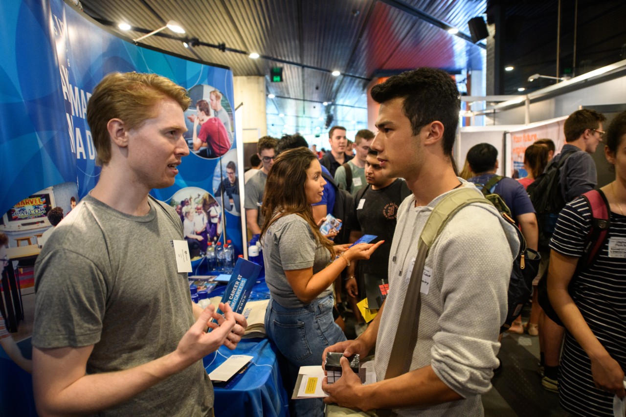 Student speaking with employer at Engineering Careers Fair