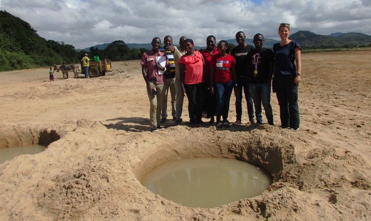 Dr Jacqueline Thomas and the WaSH team from Ifakara Health Institute viewing shallow open wells in Kondoa District in Tanzania