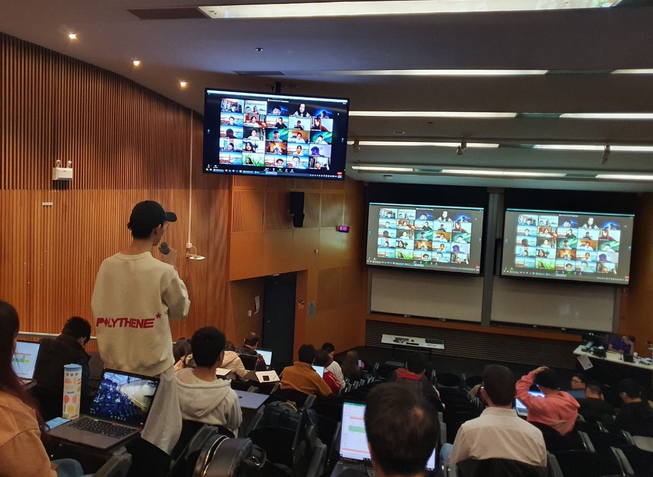 University lecture to students on campus and studying remotely
