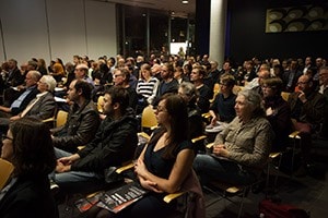 Image of people listening to a lecture