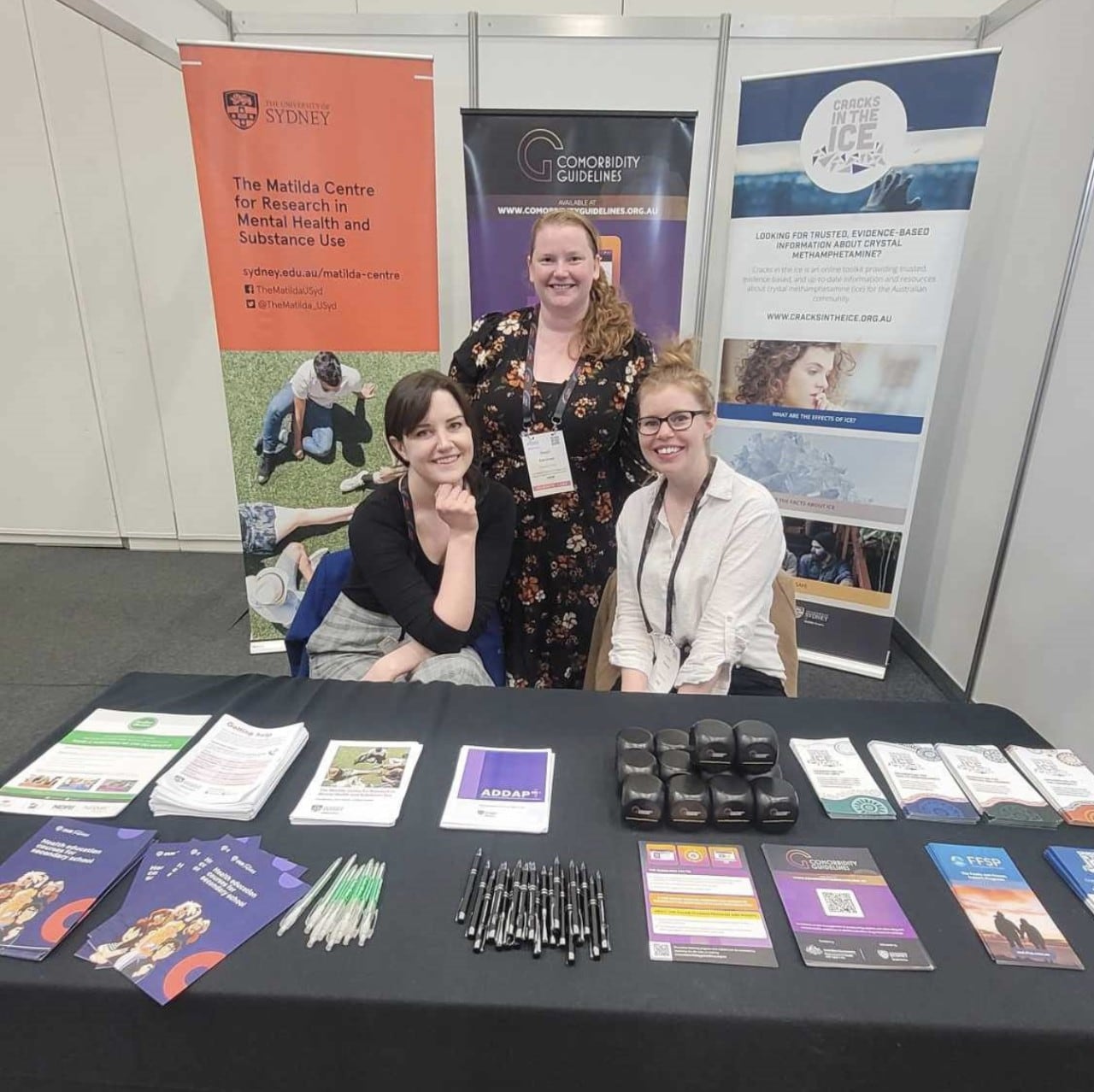 Dr Steph Kershaw, Erin Madden and Jasmine Bartlett at the Matilda Centre booth at the MHS Conference in August. 