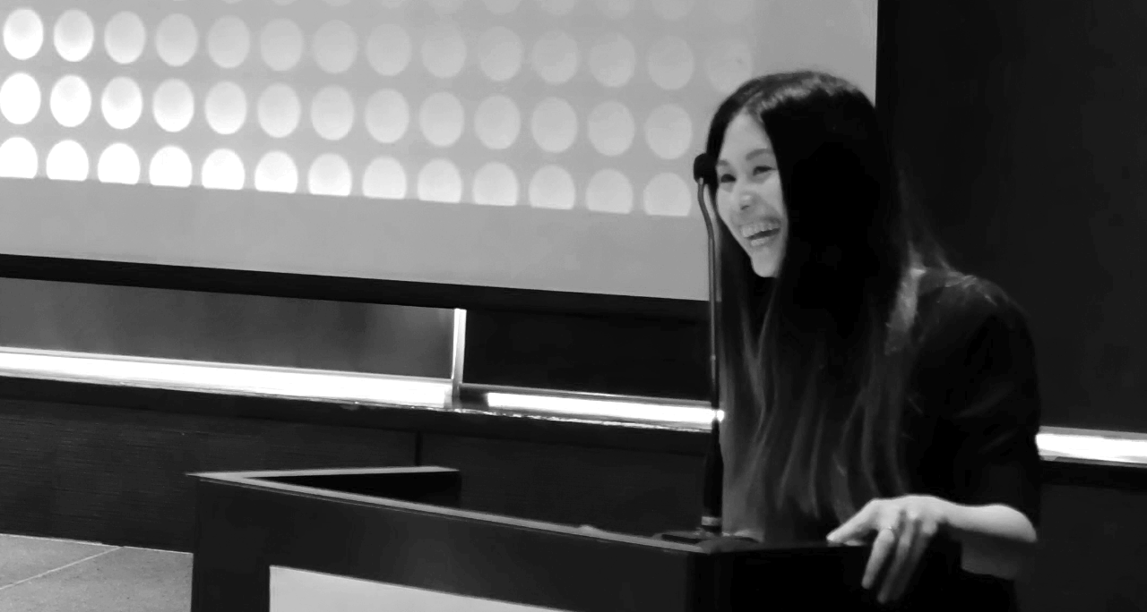 Natalie Tan speaking at a conference