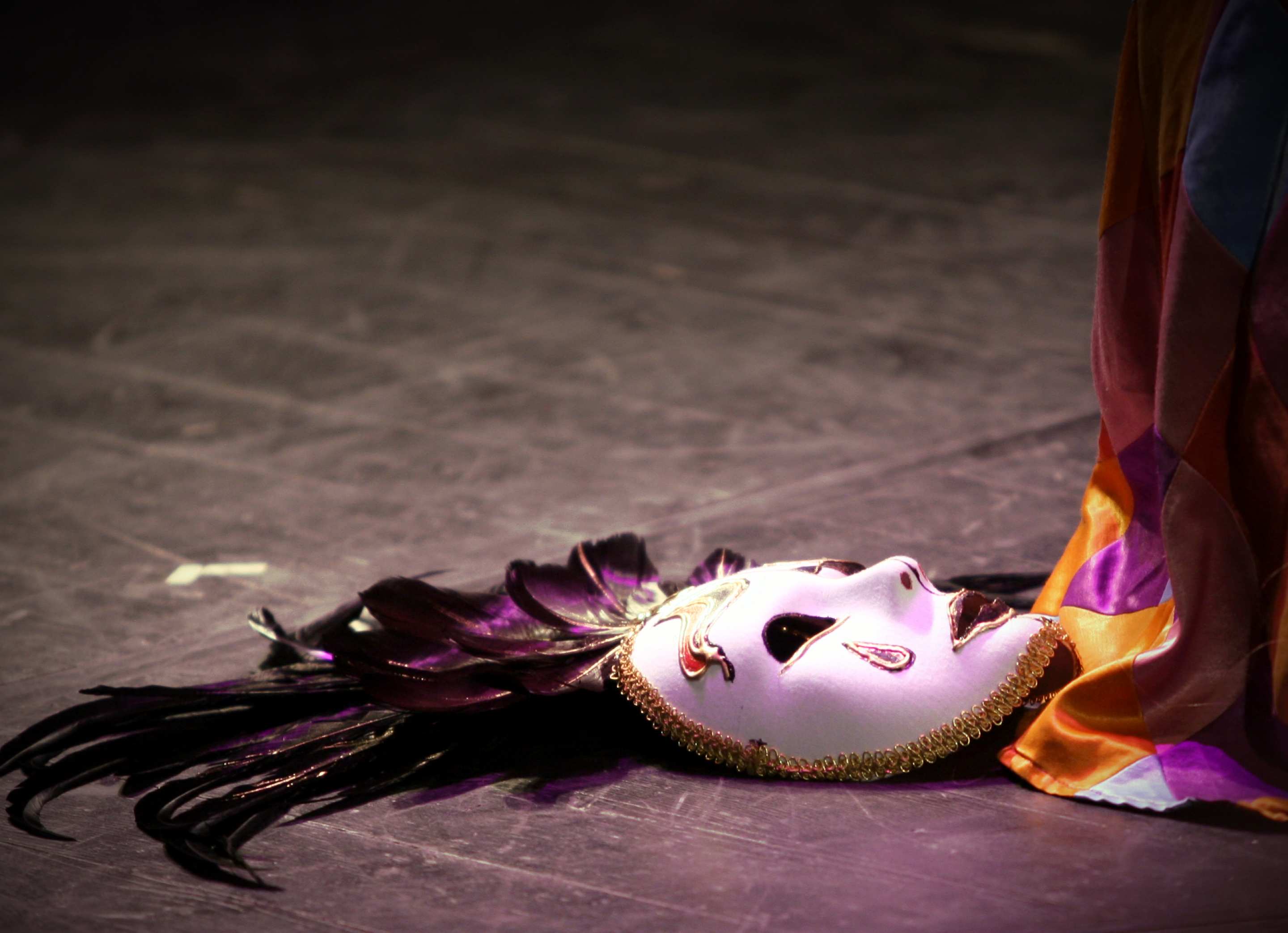 A stage performer's mask lies beside a stage curtain. Image: freeimages.com
