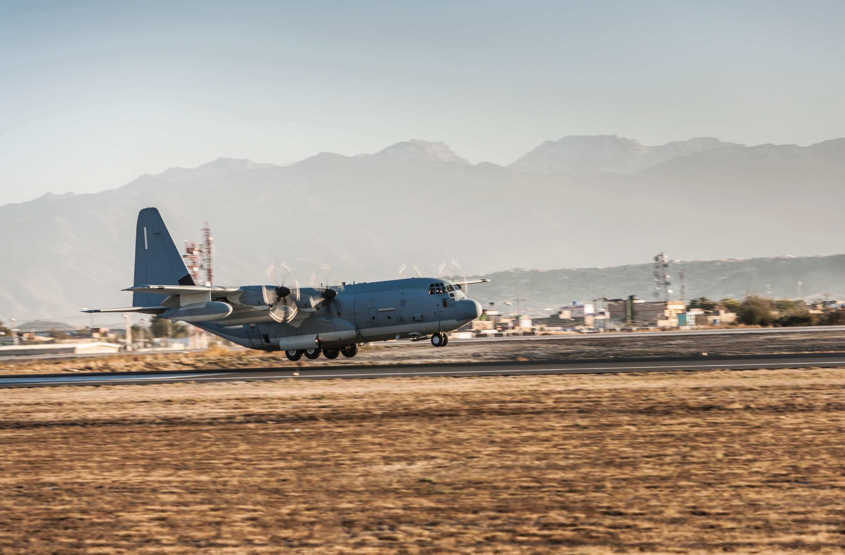 A Hercules C130 tactical air lifter touches down on a runway for landing. Image: iStock