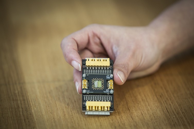 A semiconductor qubit device mounted on a custom cryogenic printed circuit board. Photo: Jayne Ion