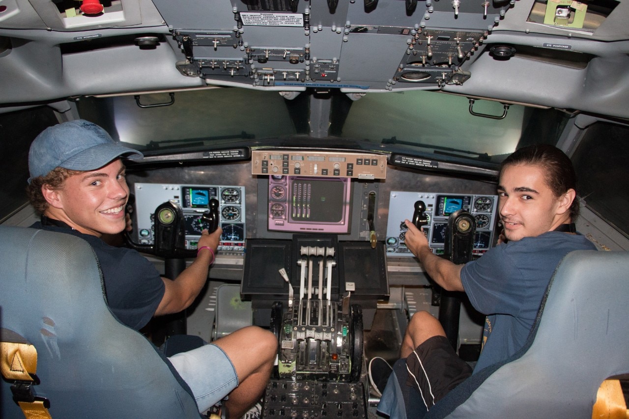 A photo of students in the flight simulator.