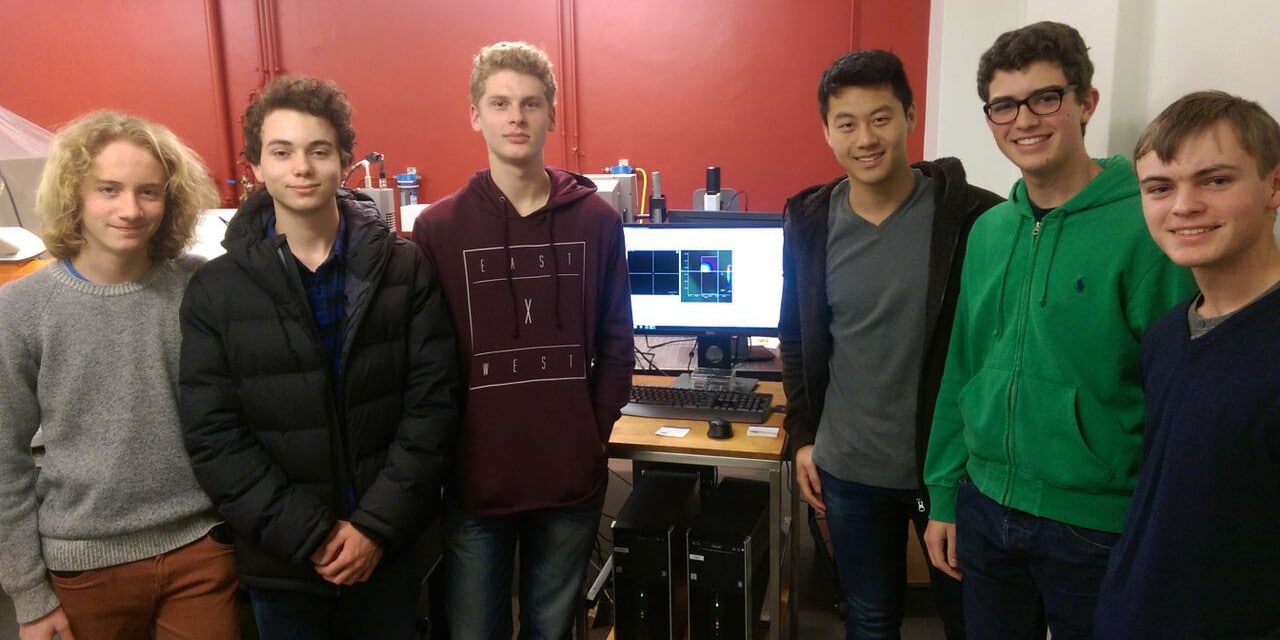 Six Sydney Grammar students in the Vibrational Spectroscopy Core Facility. 