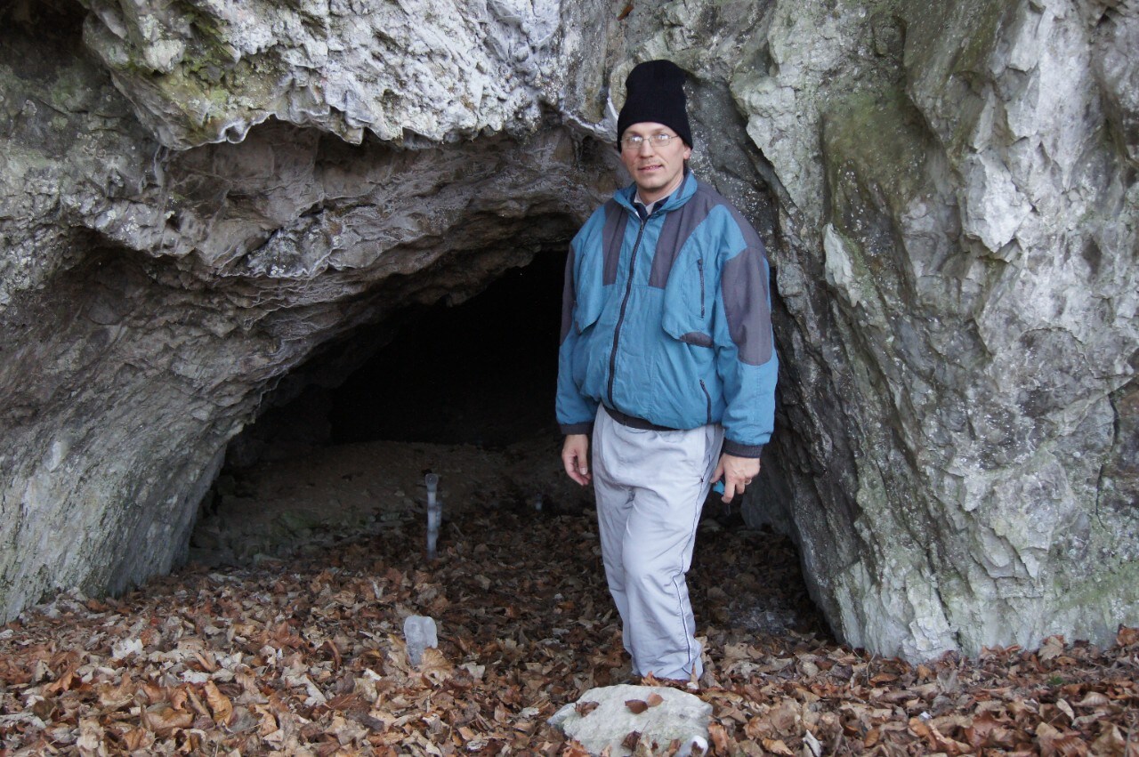 Dr Ladislav Nejman of the University of Sydney stands outside Pod Hradem Cave in the Czech Republic. Photo: Petr Skrdla