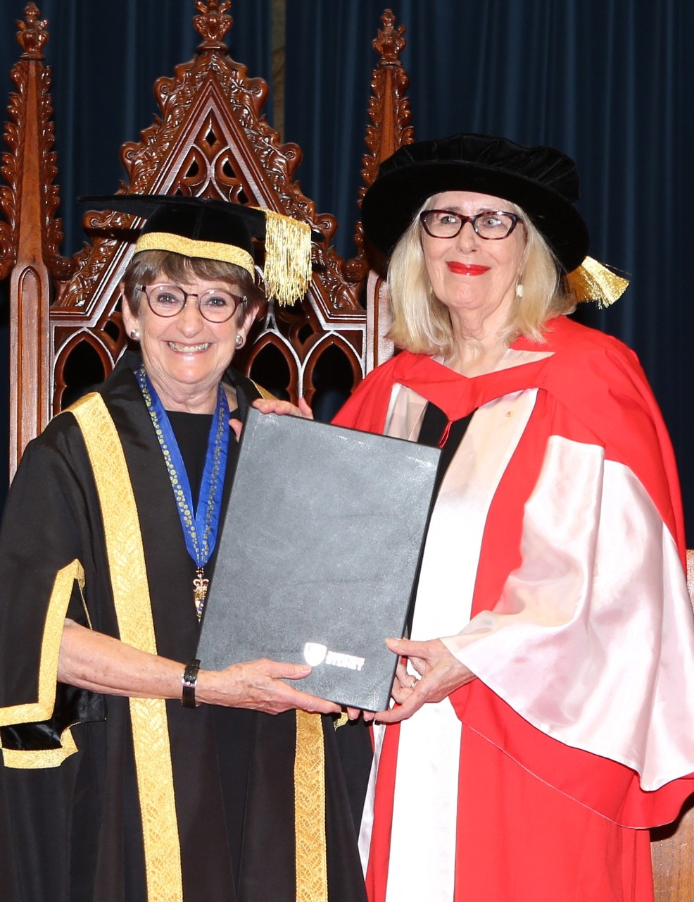 Pro-Chancellor, Mrs Dorothy Hoddinott AO presents a Doctor of Letters (honoris causa) to Dr Anne Summers Ao. 