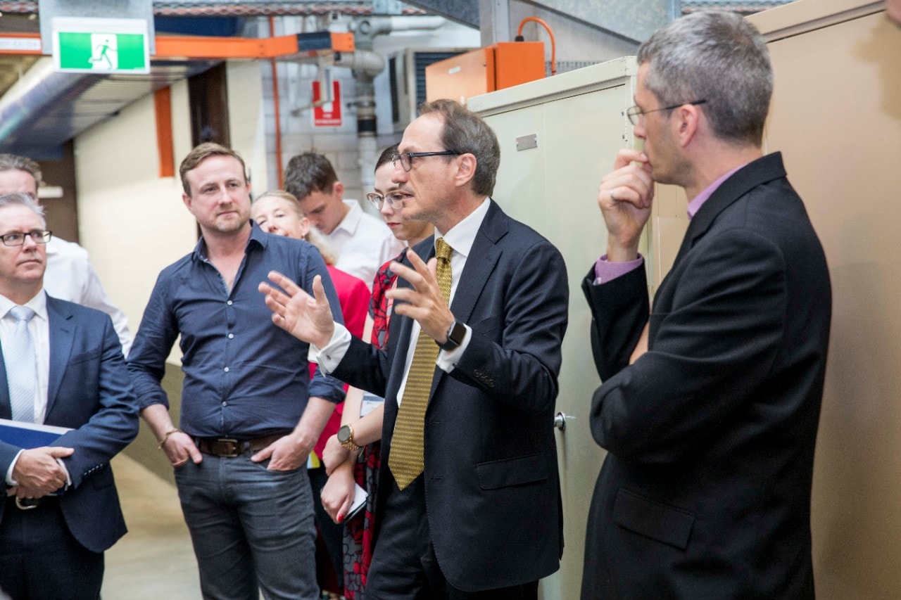Representatives from GE Additive receiving a tour of the University's facilities with Professor Simon Ringer.