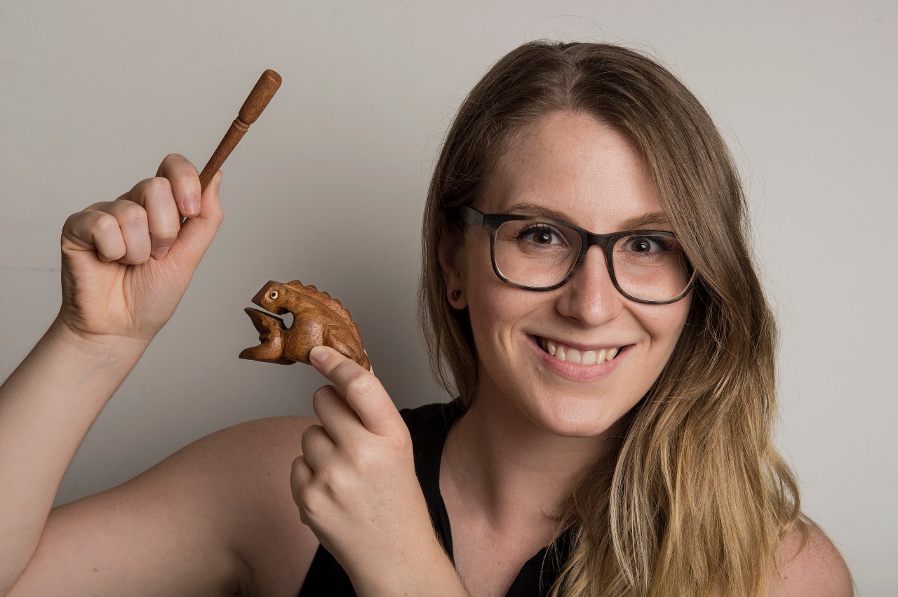 Master of Music (Composition) student Alexis Weaver with one of the instruments in her frog percussion. Photo: Steven Siewart 