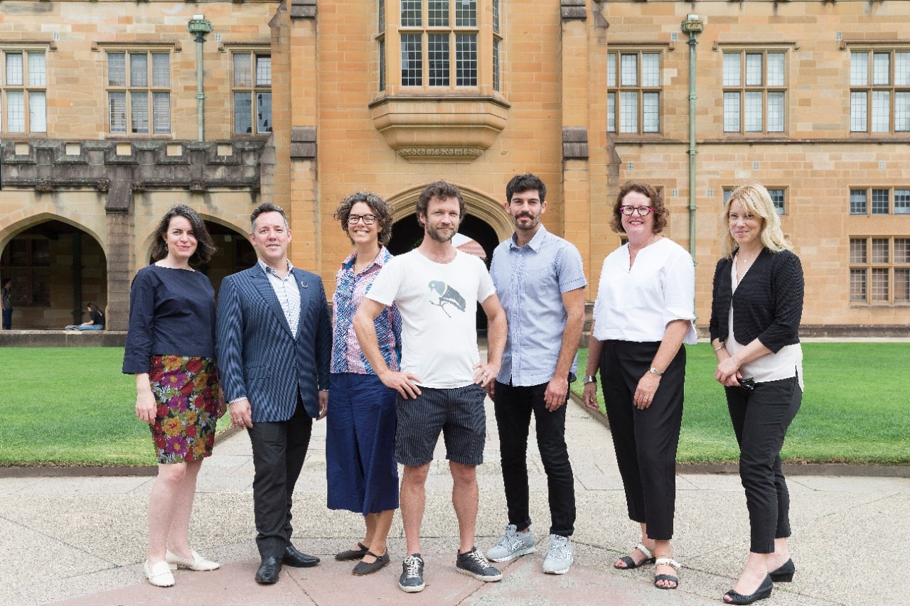 The 2018 Sydney Policy Fellows standing in the Quadrangle. from left: Eliza Ginnivan, Troy Roderick, Carolyn Barker, Dr Oisin Sweeney, Euan Brown, Susan Price and Jenny Norderyd.