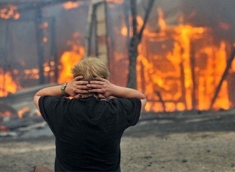 Person in front of bushfire