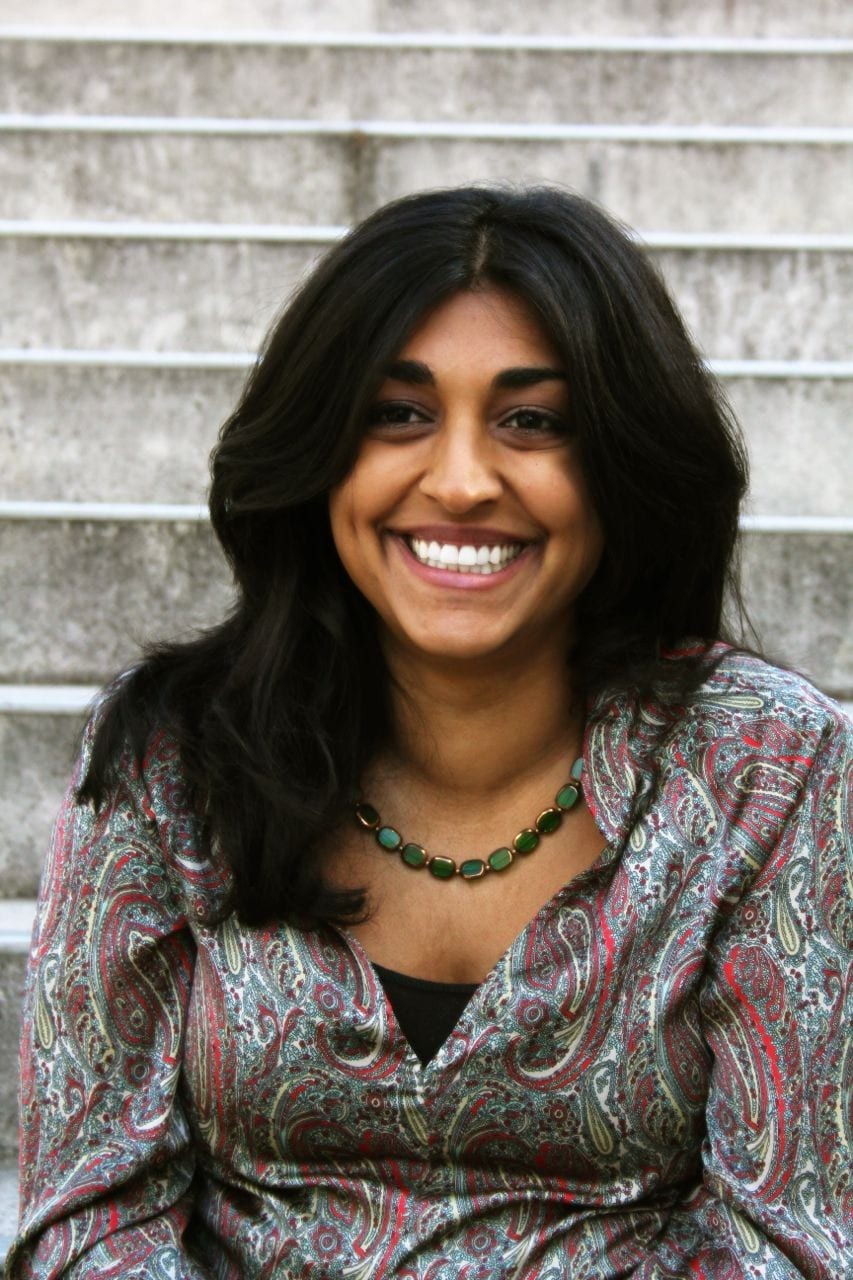 A photo of Rupal Isman, smiling.