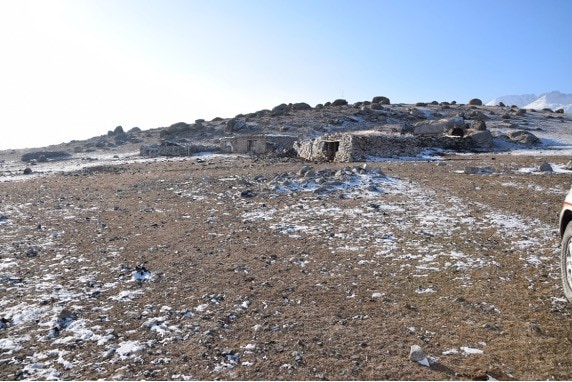 Traditional winter camp in south-facing sheltered location with low snow cover. 