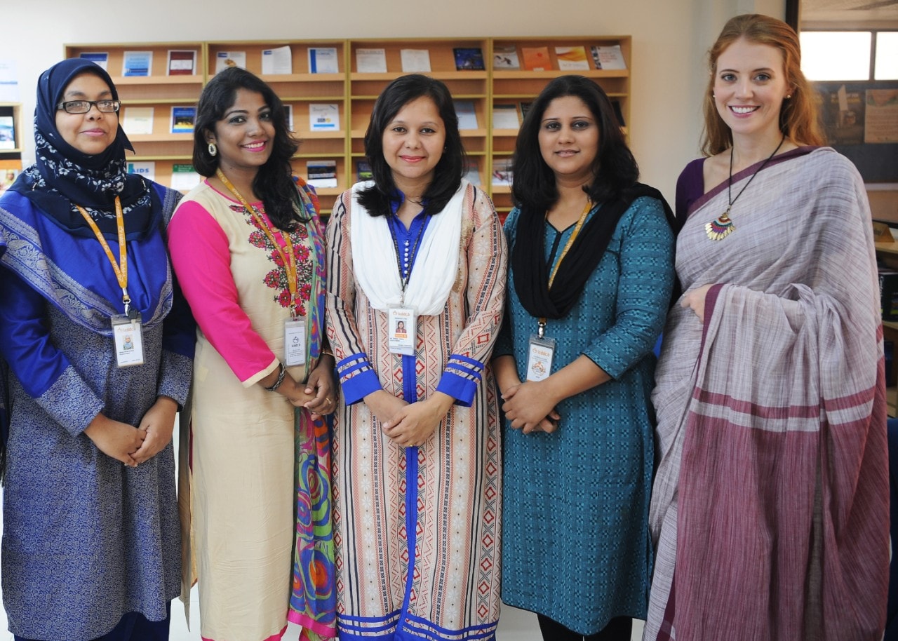 Dr Erin Hunter (right) with collaborators at the icddr,b in Bangladesh