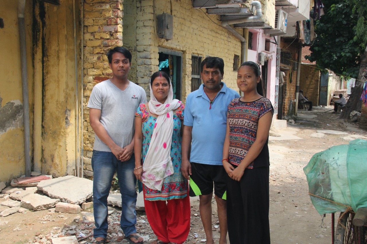 Tushar Joshi stands with mother Samta, father Santosh and sister Juhi in Mayapuri, west Delhi.