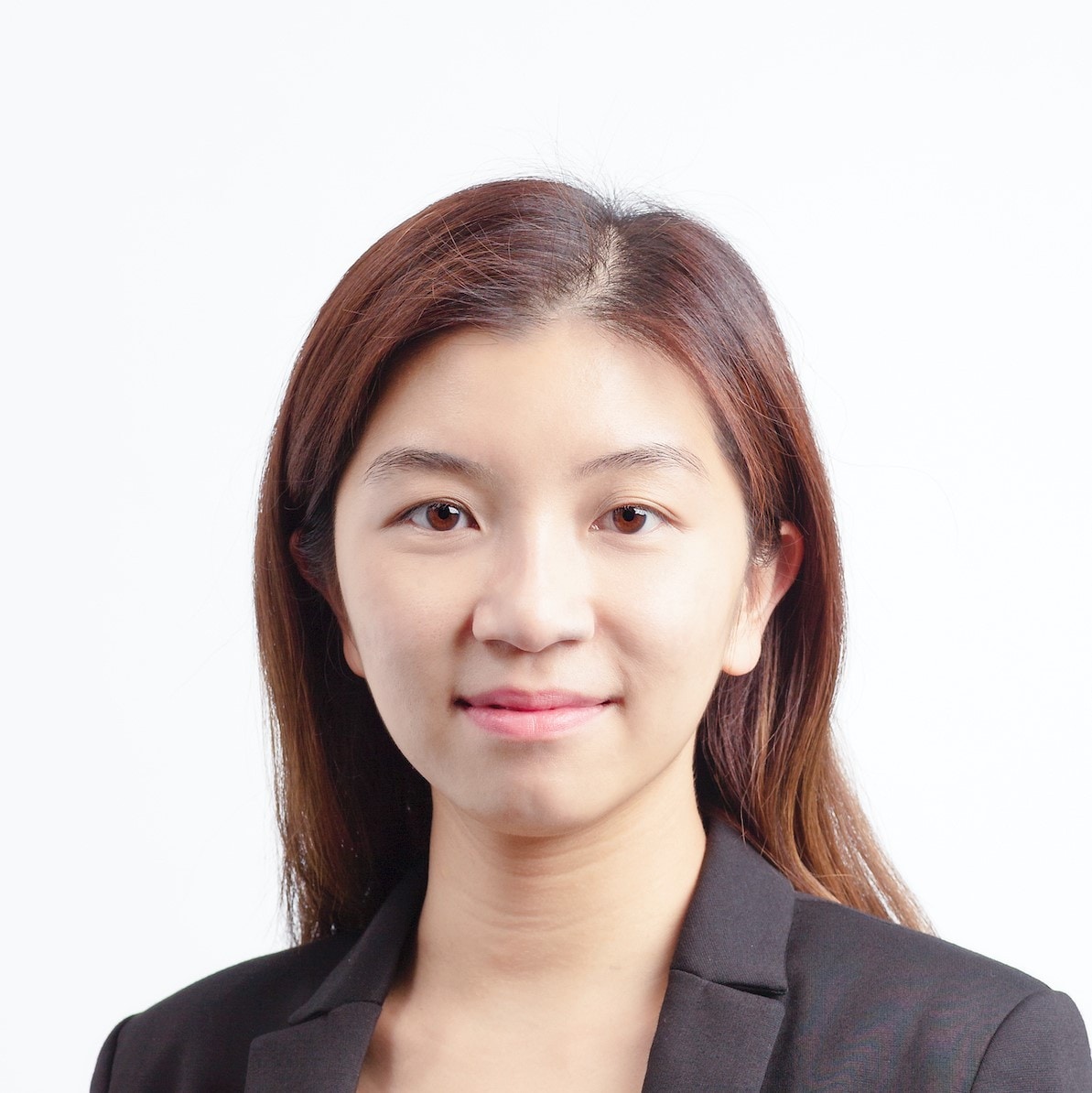 Asian woman with brown hair wearing a black blazer smiling to the camera