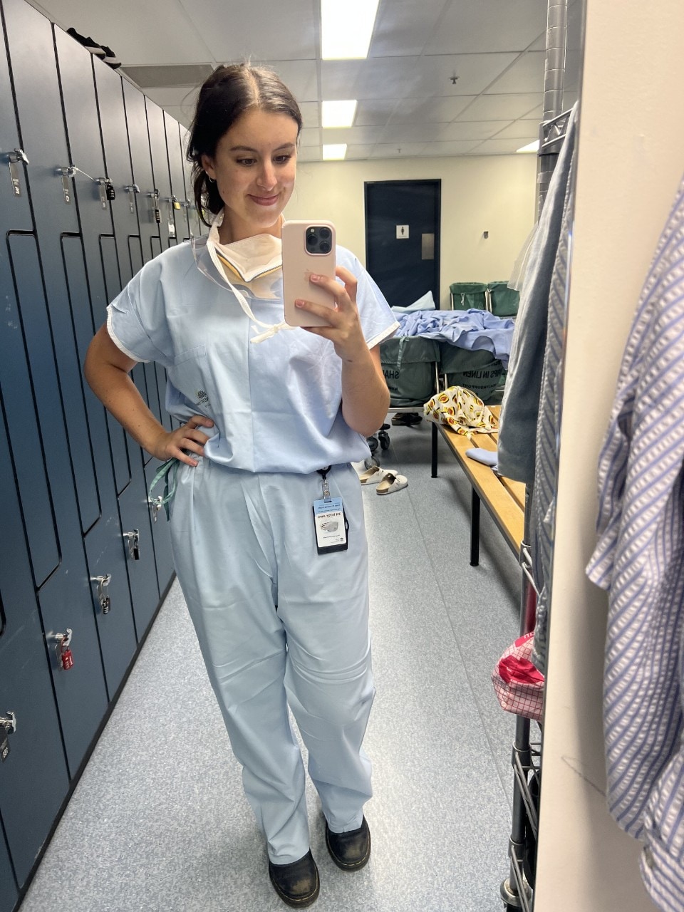 Maddi Eveleigh in her hospital scrubs