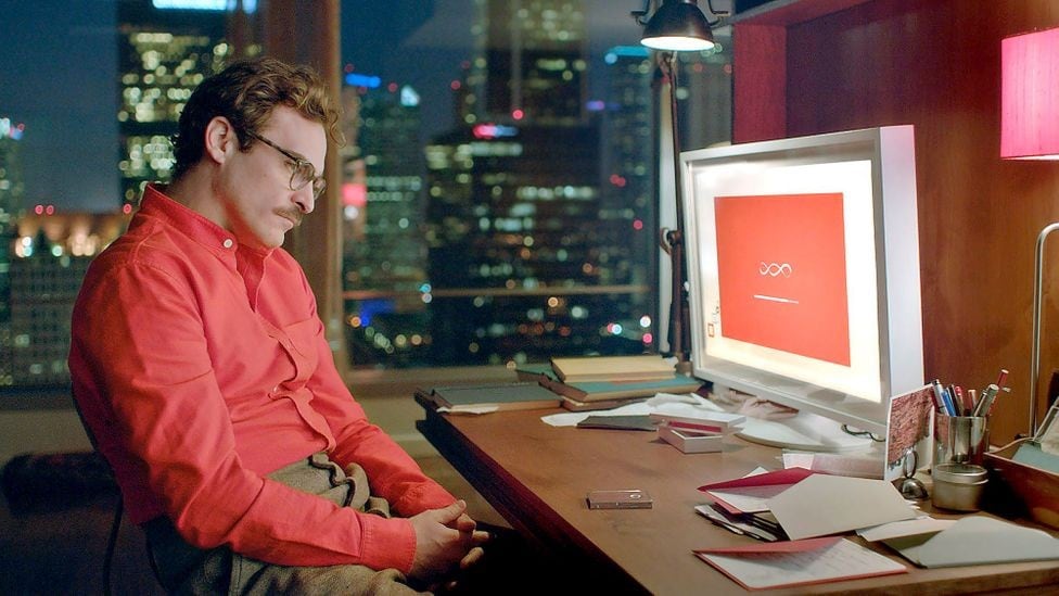Actor Joaquin Phoenix sits looking at a computer