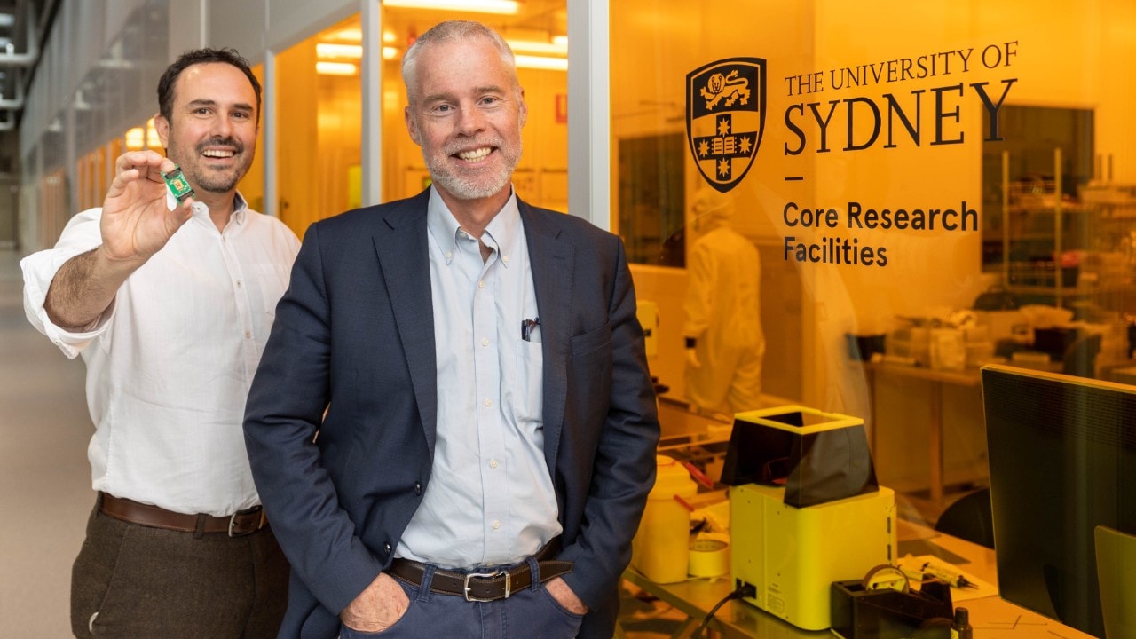Dr Alvaro Casas Bedoya, holding the new chip, with Professor Ben Eggleton in the Sydney Nanoscience Hub.