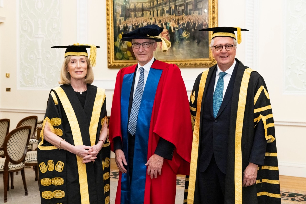 Image of three people in university gowns