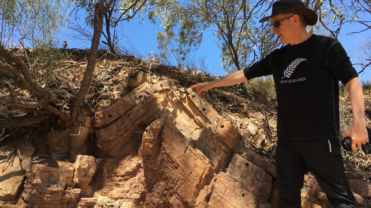 Professor Dietmar Müller points to carbonates overlying glacial deposits in the Flinders Ranges.