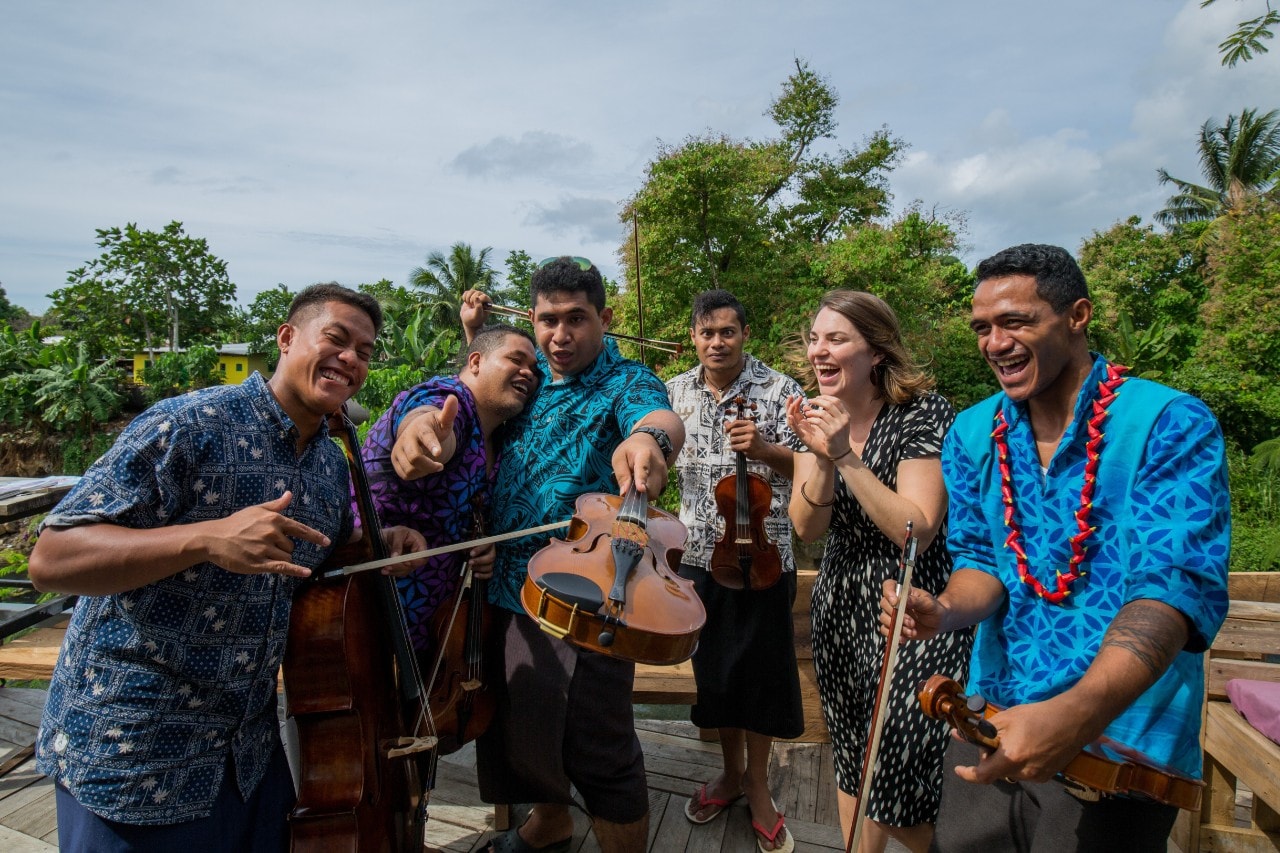 Beatrice Carey with members of the Samoan Orchestra