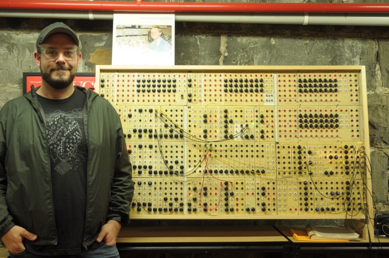 Ben Carey standing in front of a Serge Paperface modular synthesiser