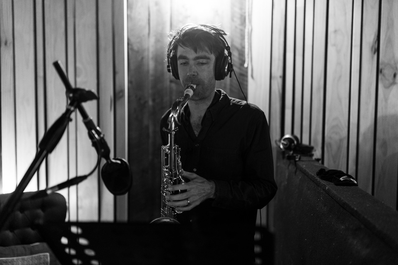 Jeremy Rose playing the trumpet in a studio