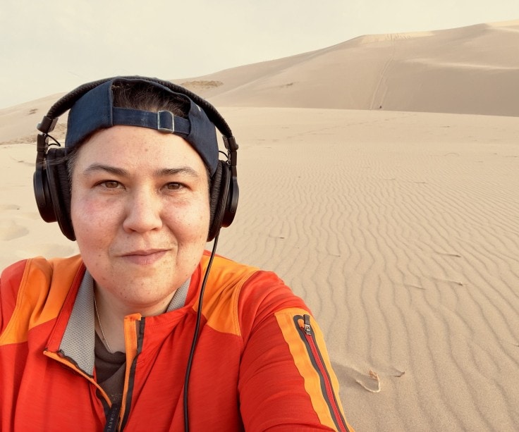 Photo of Diana Chester smiling in desert