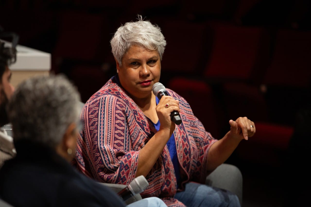 Denise Bowden, CEO of the Yothu Yindi Foundation, speaking into a microphone