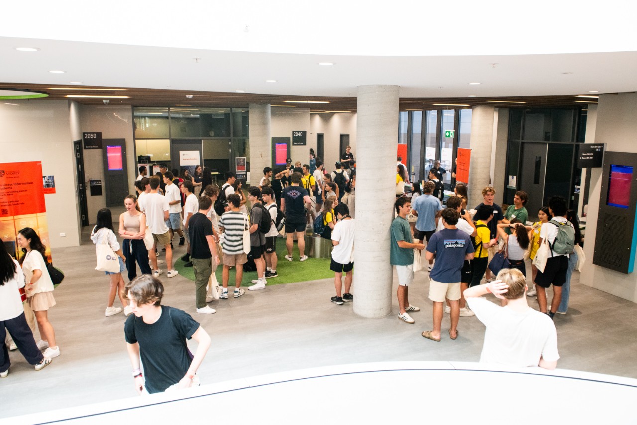 A group of undergraduate students in a foyer